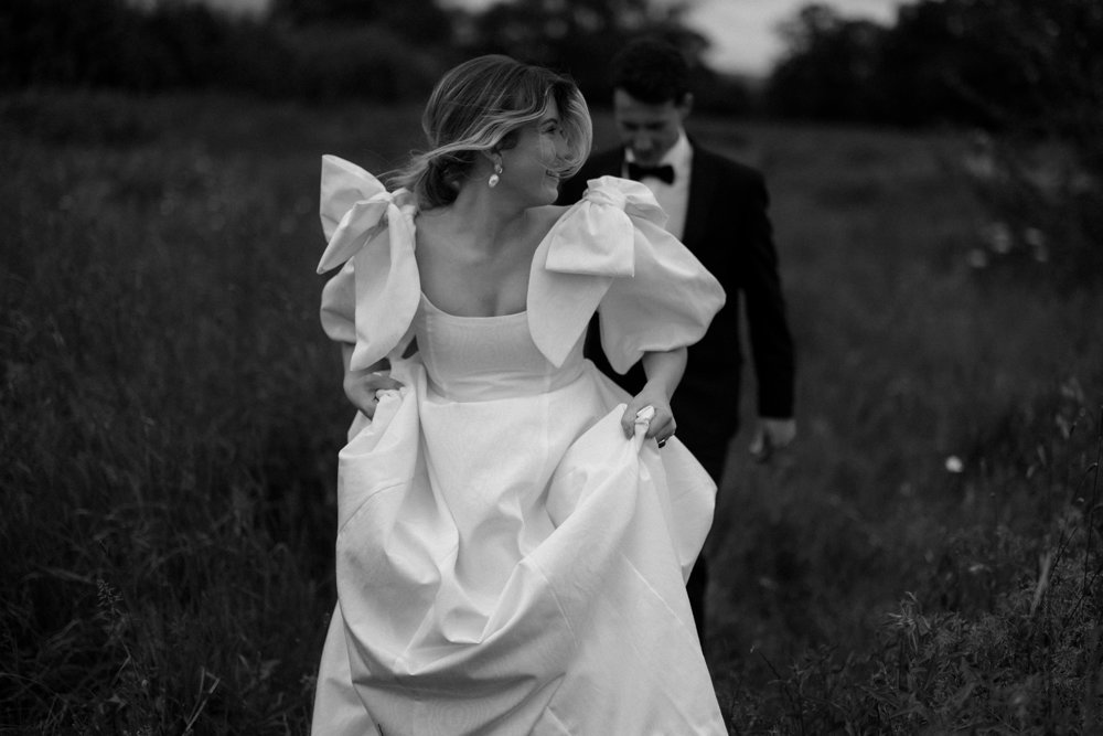 Bridal style in 2023 is big bows and messy hair