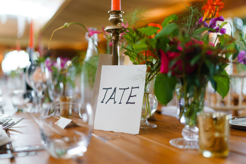 Brightly coloured wedding reception flowers and decor ideas