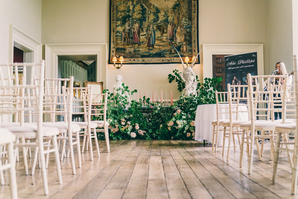 The hall at stately home wedding venue in gloucester decorated for a wild wedding fair in september