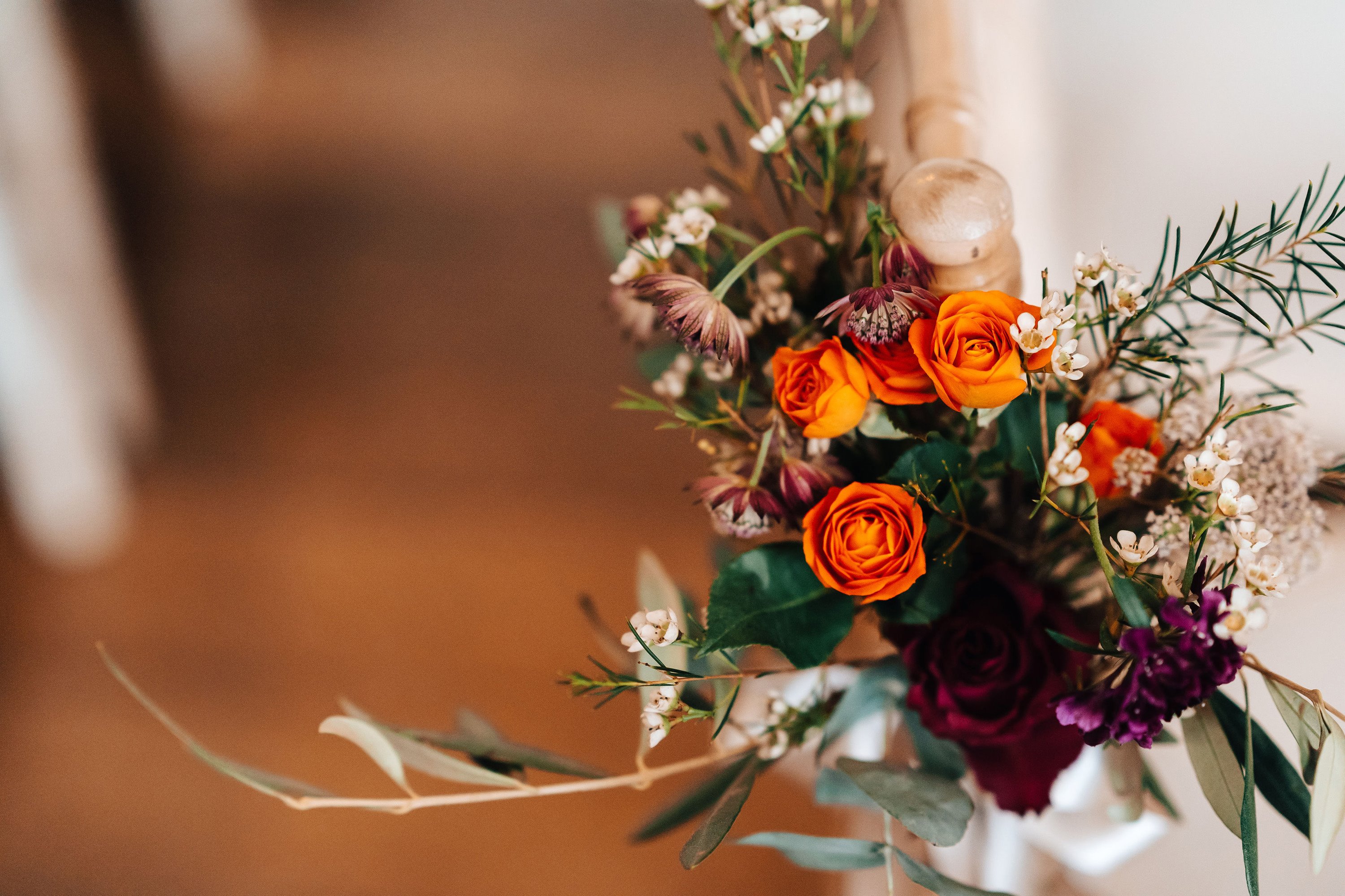 Autumn wedding bouquet with orange roses