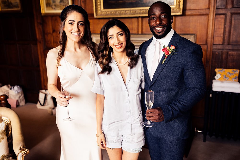 Bride with her bridemaid and bridesman at wild wedding venue elmore court in the cotswolds