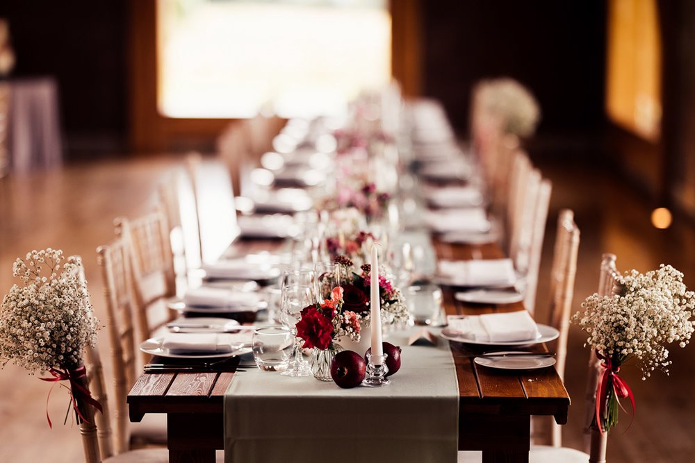 wedding tables with red white and pink decorations
