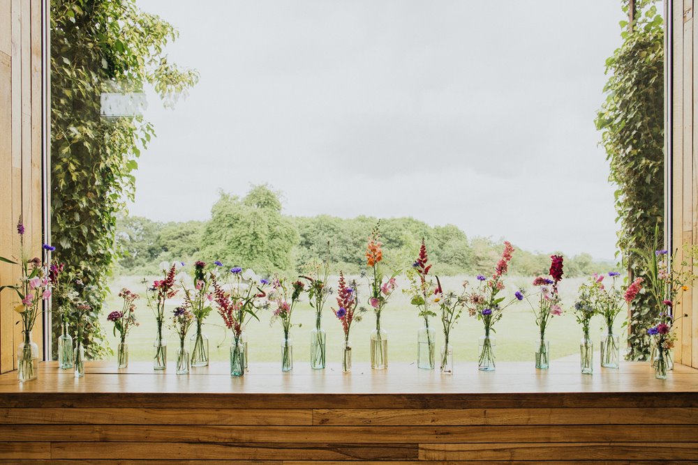 Wildflowers in tiny vases the window 2021 inspiration